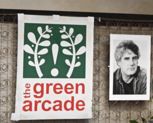 Green Arcade Bookstore sign and a photo of Jim Nisbet
